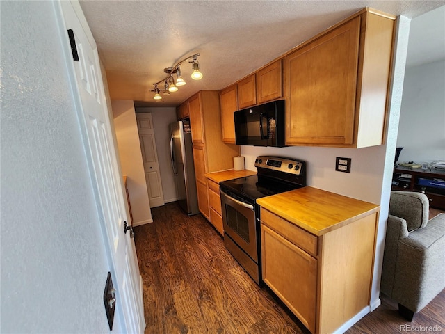 3354 S Flower St Unit 70, Lakewood, CO 80227 - kitchen featuring appliances with stainless steel finishes, dark wood-style flooring, brown cabinetry, and light countertops