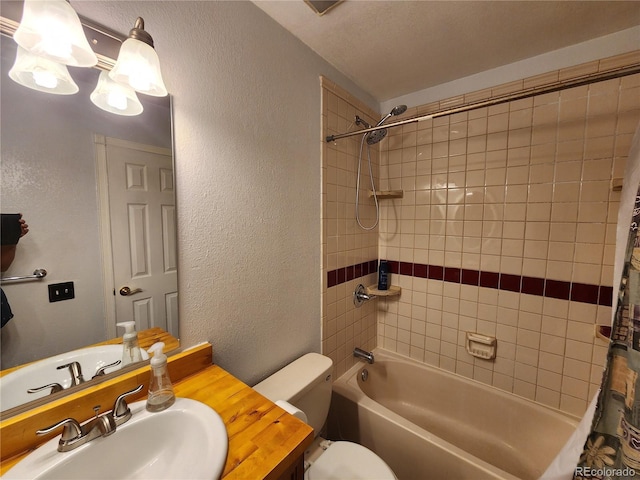 3354 S Flower St Unit 70, Lakewood, CO 80227 - full bathroom featuring a textured wall, shower / tub combo with curtain, and vanity