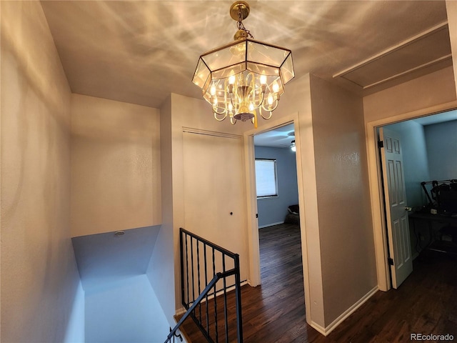 3354 S Flower St Unit 70, Lakewood, CO 80227 - hall with wood finished floors, an upstairs landing, a chandelier, and attic access