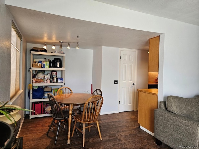 3354 S Flower St Unit 70, Lakewood, CO 80227 - dining space featuring dark wood finished floors and baseboards