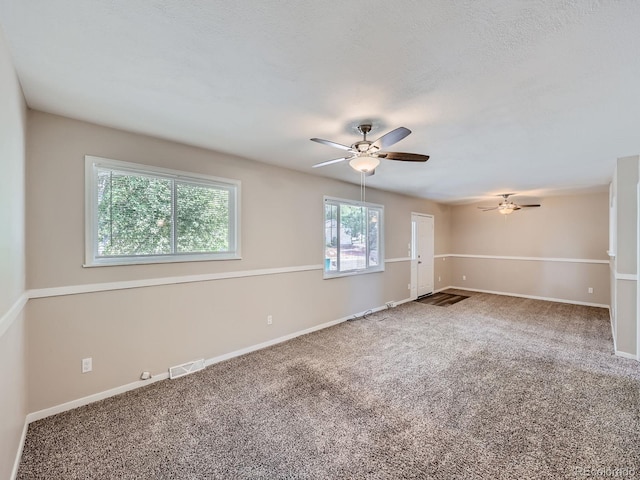 carpeted empty room with ceiling fan