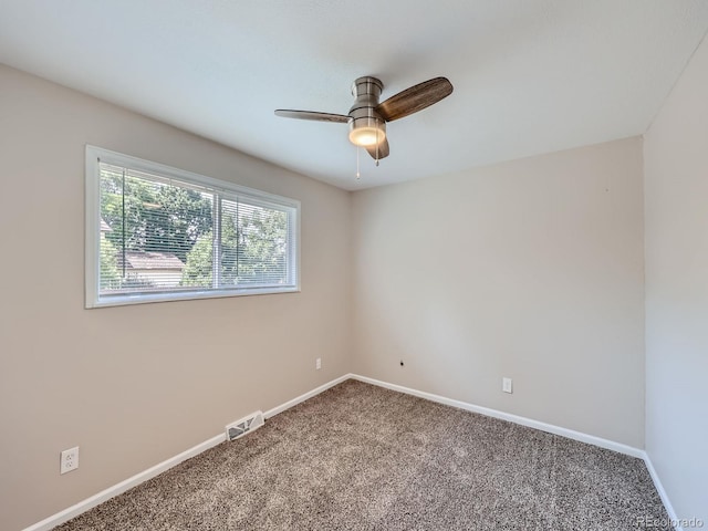 unfurnished room featuring carpet and ceiling fan