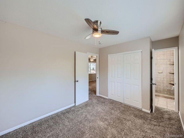 unfurnished bedroom with ensuite bathroom, carpet, ceiling fan, and a closet