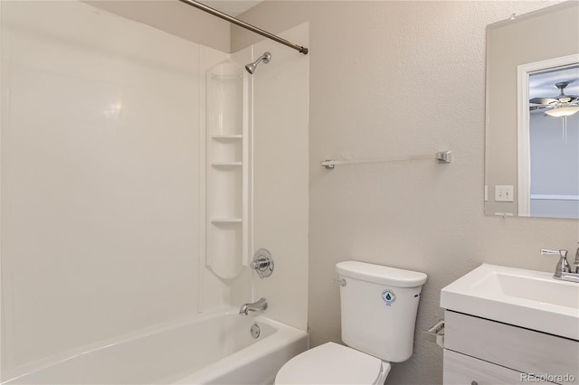 full bathroom featuring vanity, toilet, ceiling fan, and bathtub / shower combination