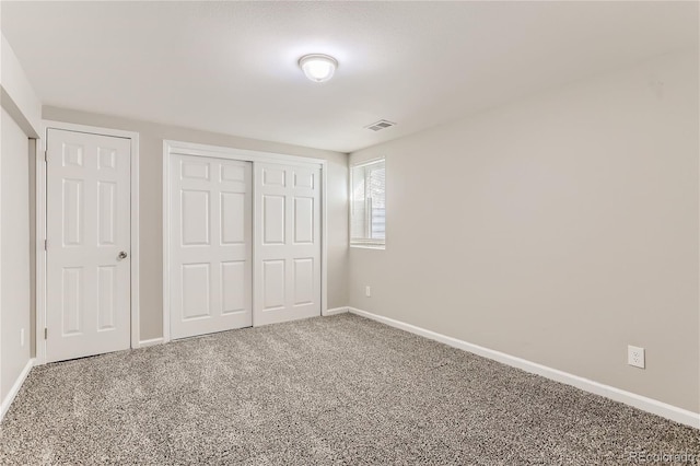 unfurnished bedroom with carpet flooring