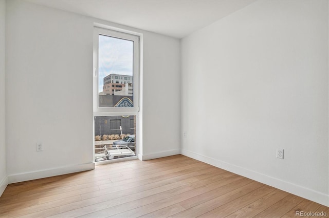 spare room featuring light hardwood / wood-style floors