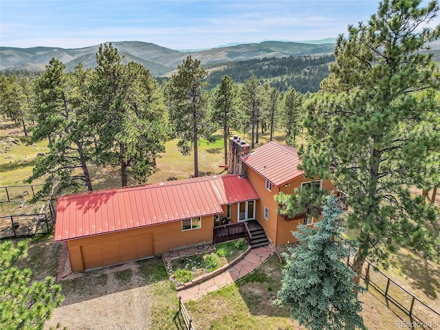 birds eye view of property with a mountain view