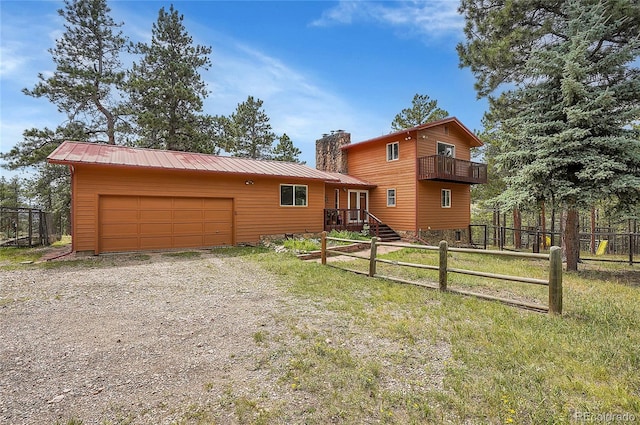 view of front of house featuring a garage and a front yard