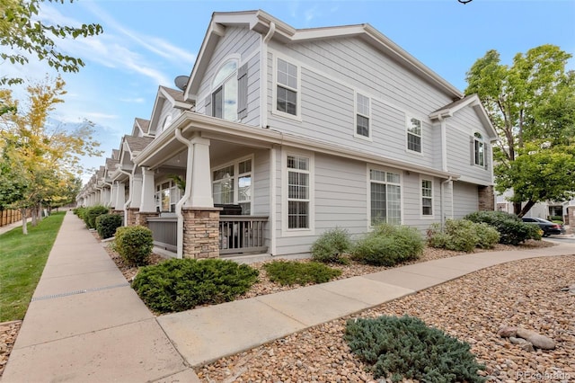 view of property exterior featuring a porch