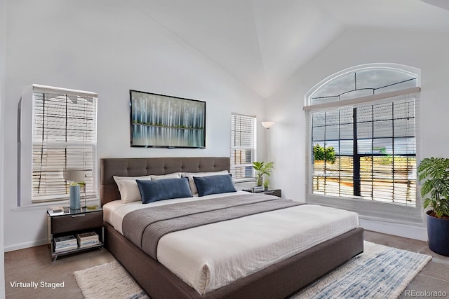 bedroom featuring high vaulted ceiling, carpet, and baseboards