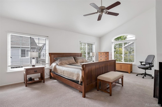 bedroom with vaulted ceiling, ceiling fan, baseboards, and light colored carpet