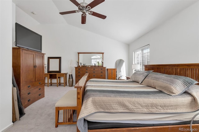 bedroom featuring light carpet, ceiling fan, and vaulted ceiling