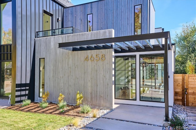 entrance to property with a balcony