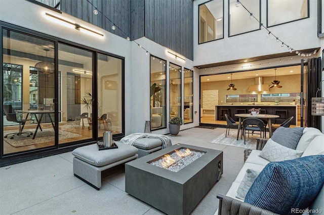 view of patio featuring an outdoor fire pit