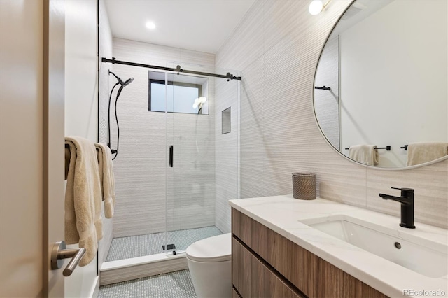 bathroom featuring decorative backsplash, an enclosed shower, vanity, tile walls, and toilet