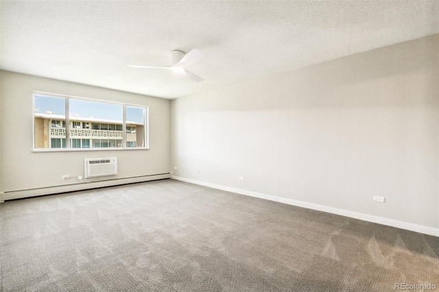 725 S Alton Way Unit 9C, Denver, CO 80247 - carpeted empty room with a baseboard radiator, a wall mounted air conditioner, a ceiling fan, and a textured ceiling