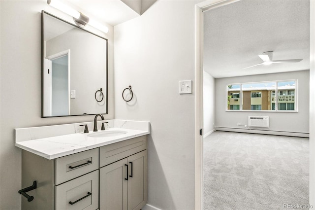 725 S Alton Way Unit 9C, Denver, CO 80247 - bathroom with vanity, a wall mounted air conditioner, and a ceiling fan