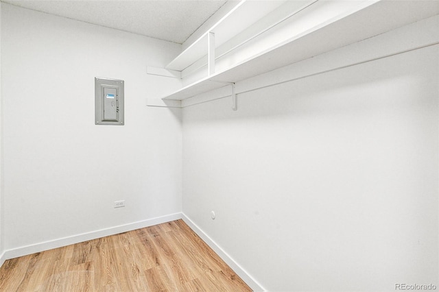 725 S Alton Way Unit 9C, Denver, CO 80247 - walk in closet featuring electric panel and light wood-style floors