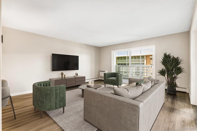 725 S Alton Way Unit 9C, Denver, CO 80247 - living room with wood finished floors and a baseboard heating unit