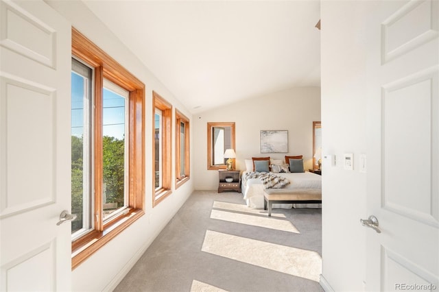 carpeted bedroom with vaulted ceiling