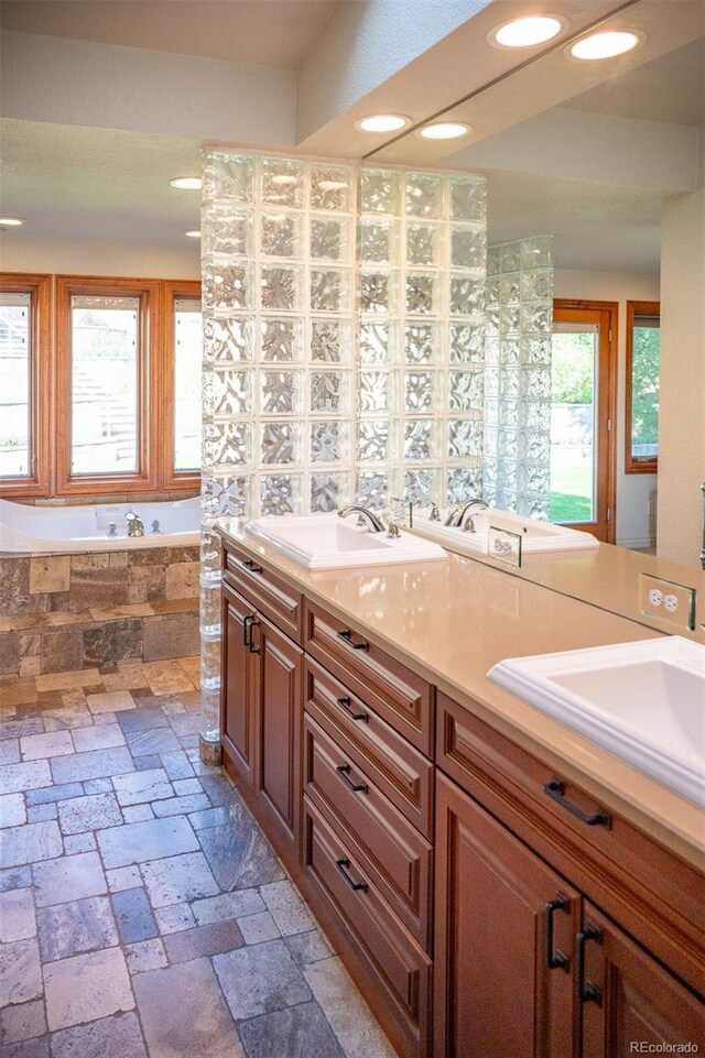 bathroom with vanity and a bathing tub