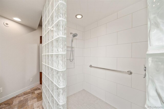 bathroom with a tile shower