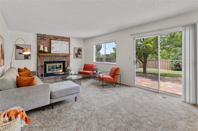 8441 S Timberwood St, Highlands Ranch, CO 80126 - carpeted living room featuring a textured ceiling and a brick fireplace