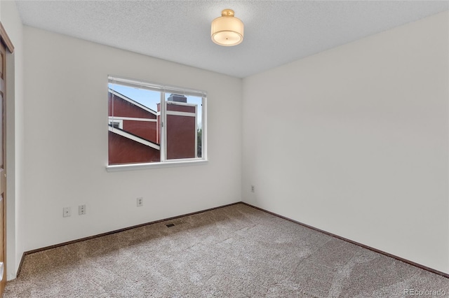 8441 S Timberwood St, Highlands Ranch, CO 80126 - carpeted empty room featuring baseboards and a textured ceiling