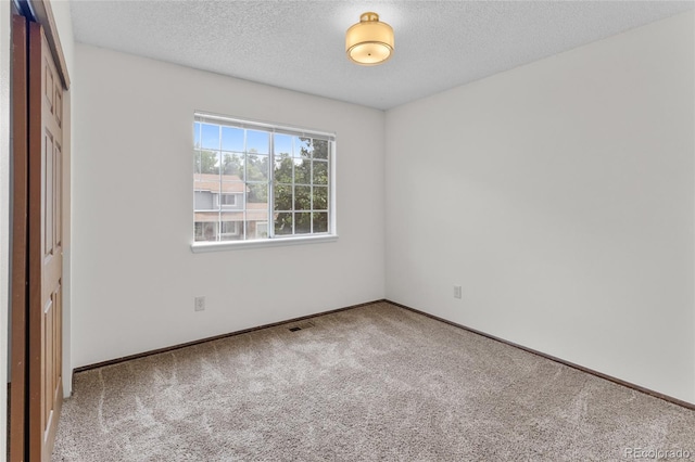 8441 S Timberwood St, Highlands Ranch, CO 80126 - unfurnished bedroom with carpet, a closet, and a textured ceiling