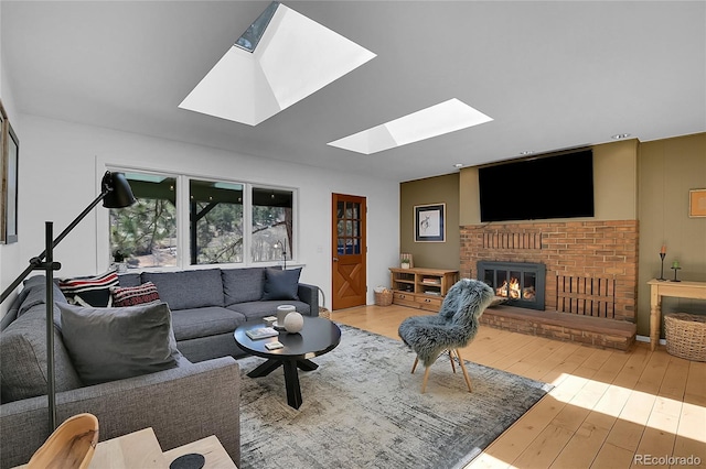 29858 Gigi Dr, Evergreen, CO 80439 - living area with a skylight, a fireplace, and hardwood / wood-style floors