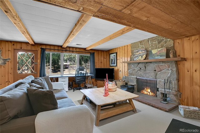 29858 Gigi Dr, Evergreen, CO 80439 - living area with a fireplace, wooden walls, and beam ceiling