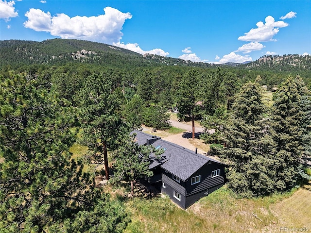 29858 Gigi Dr, Evergreen, CO 80439 - aerial view of property and surrounding area featuring a forest and a mountainous background