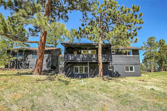 29858 Gigi Dr, Evergreen, CO 80439 - rear view of property with a lawn and a wooden deck