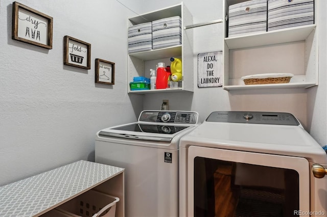 laundry area with laundry area and separate washer and dryer