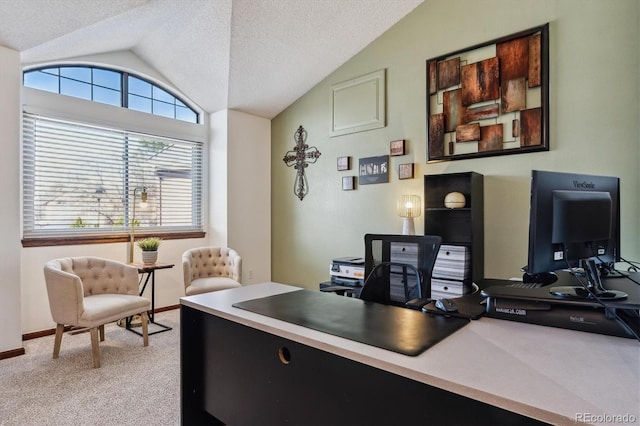 office featuring baseboards, light carpet, a textured ceiling, and vaulted ceiling