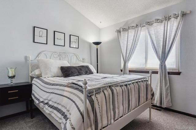 bedroom with visible vents, a textured ceiling, carpet floors, baseboards, and vaulted ceiling