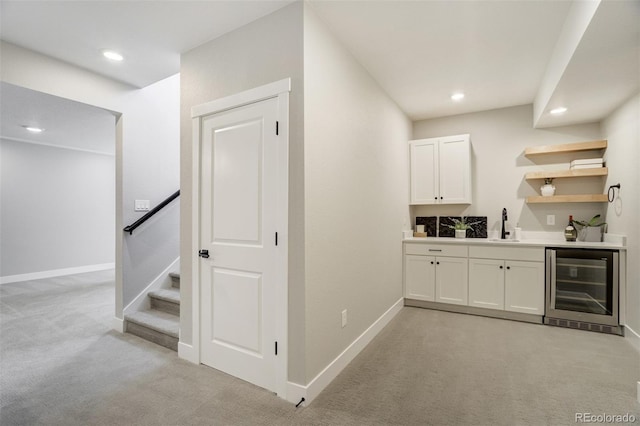 16277 Talons Bluff Ln, Monument, CO 80132 - bar with wine cooler, light colored carpet, recessed lighting, baseboards, and a sink