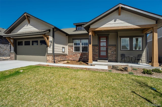 16277 Talons Bluff Ln, Monument, CO 80132 - view of front of home featuring a front yard, concrete driveway, stone siding, an attached garage, and roof with shingles