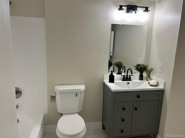 full bath featuring toilet, baseboards,  shower combination, and vanity