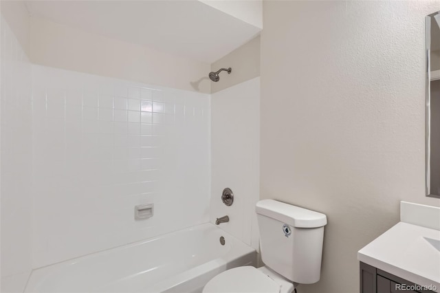 full bathroom featuring toilet, washtub / shower combination, and vanity