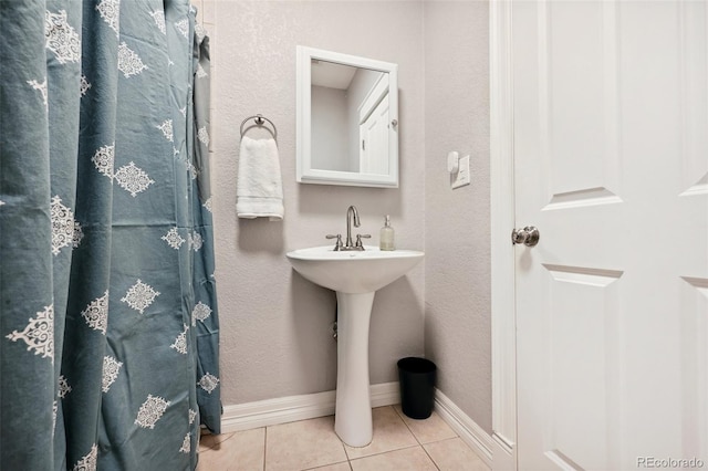 bathroom with tile patterned floors