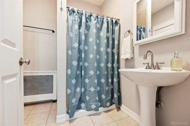 bathroom featuring tile patterned flooring and sink