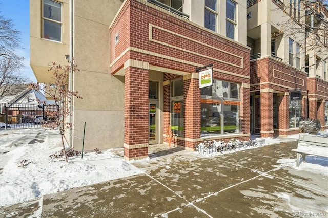 view of snow covered property entrance