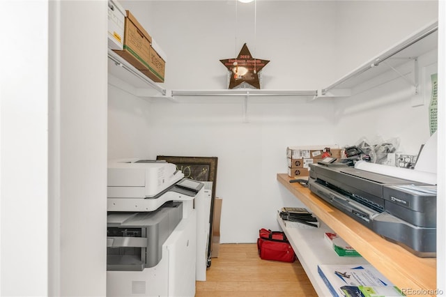 spacious closet with light hardwood / wood-style floors