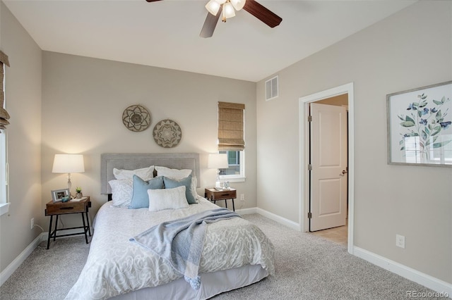 bedroom with ceiling fan and light colored carpet