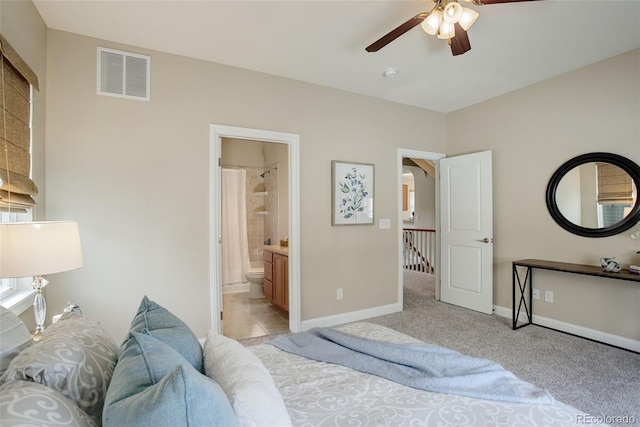 carpeted bedroom with ceiling fan and connected bathroom