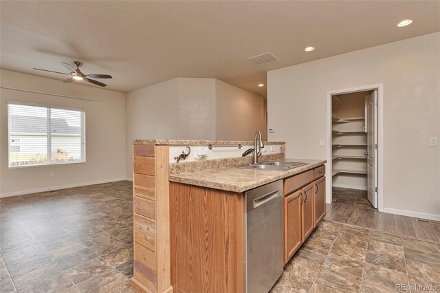 kitchen with dishwasher, ceiling fan, and sink