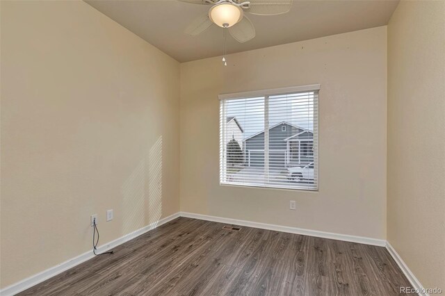 spare room featuring hardwood / wood-style floors and ceiling fan