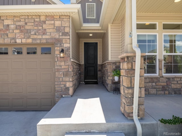 16448 E 111th Pl, Commerce City, CO 80022 - view of exterior entry featuring stone siding and board and batten siding