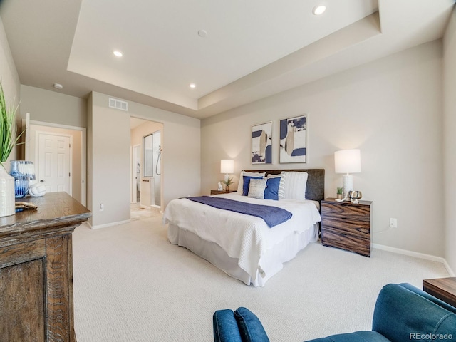 16448 E 111th Pl, Commerce City, CO 80022 - bedroom with a raised ceiling, light carpet, baseboards, recessed lighting, and connected bathroom